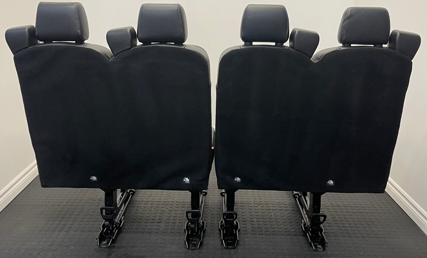 Ford Transit Passenger Van Black Vinyl Quick Release Universal Fit 4 Position Bench Seat 64” Wide Including the Seatbelt Retractor.