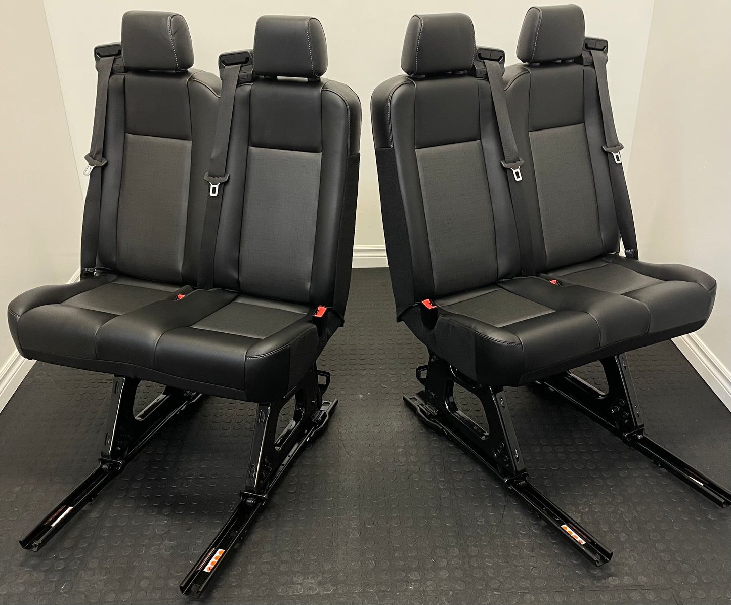 Ford Transit Passenger Van Black Vinyl Quick Release Universal Fit 4 Position Bench Seat 64” Wide Including the Seatbelt Retractor.