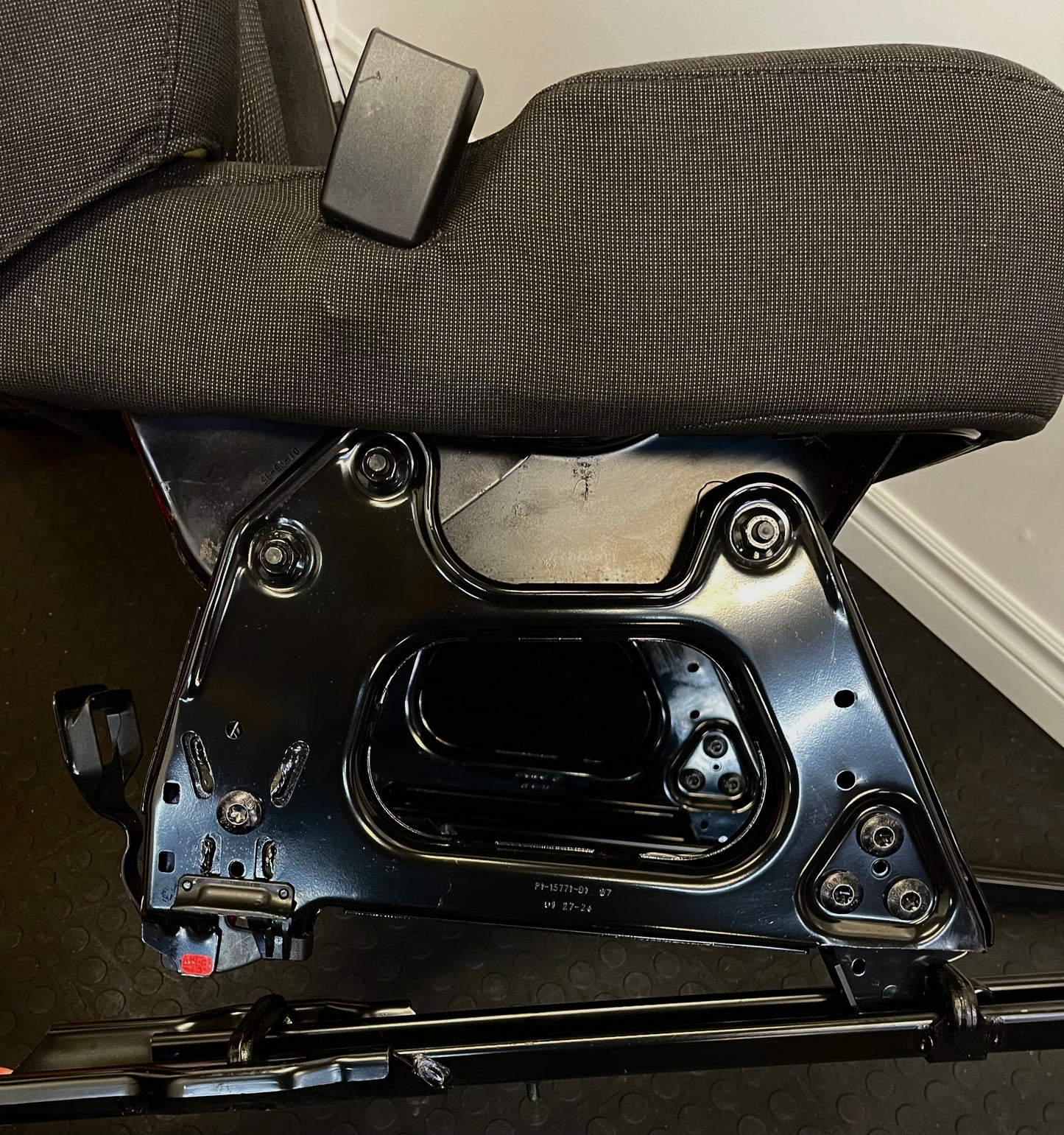 Ford Transit Passenger Van Black Cloth Quick Release Universal Fit 4 Position Bench Seat 64" Wide Including the Seatbelt Retractor.