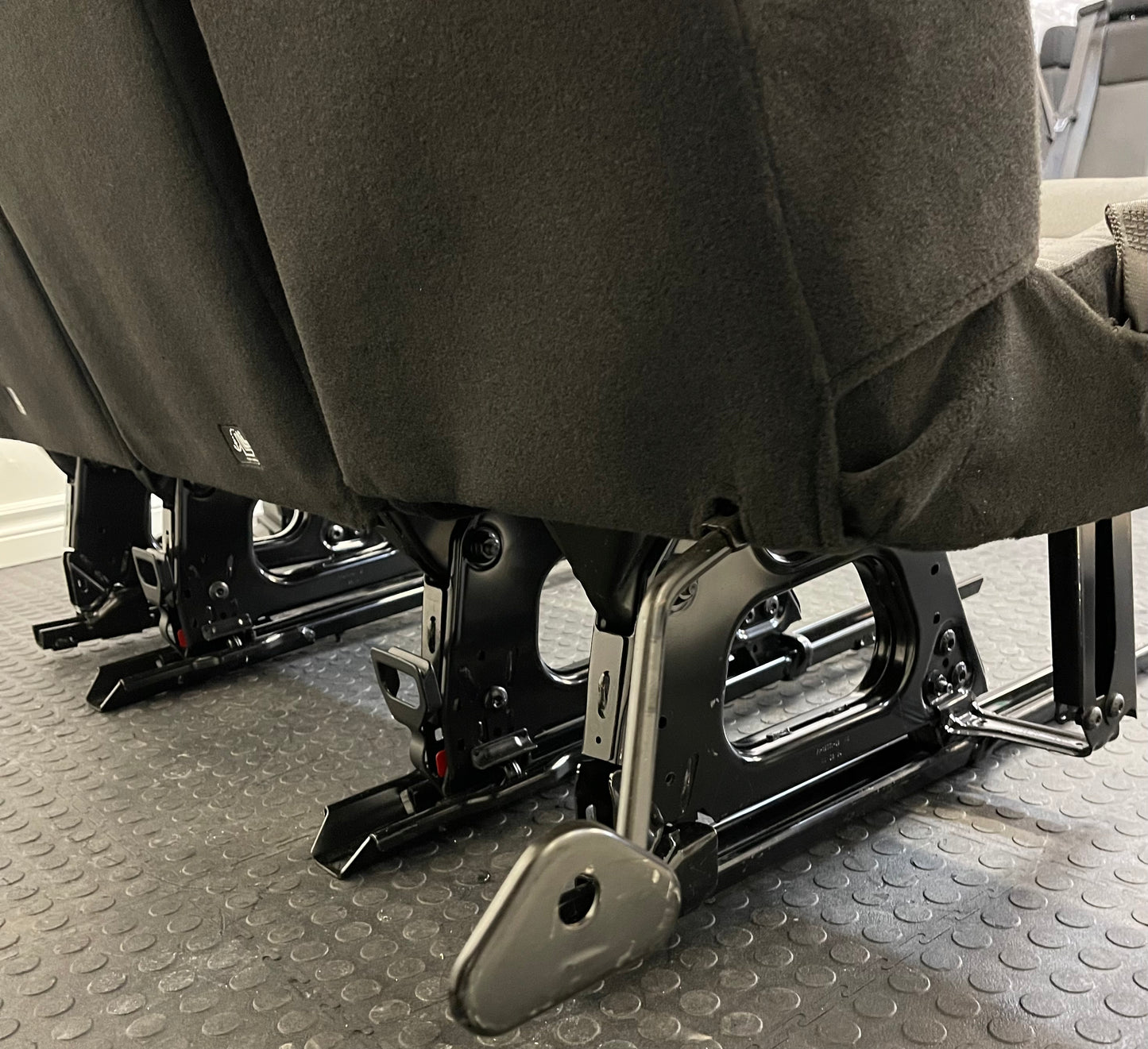 Ford Transit Passenger Van Dark Palazzo Grey Cloth Quick Release Universal Fit 4 Position Bench Seat 64" Wide Including the Seatbelt Retractor.