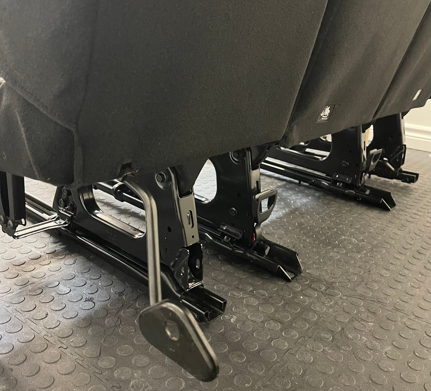 Ford Transit Passenger Van Dark Palazzo Grey Cloth Quick Release Universal Fit 4 Position Bench Seat 64" Wide Including the Seatbelt Retractor.