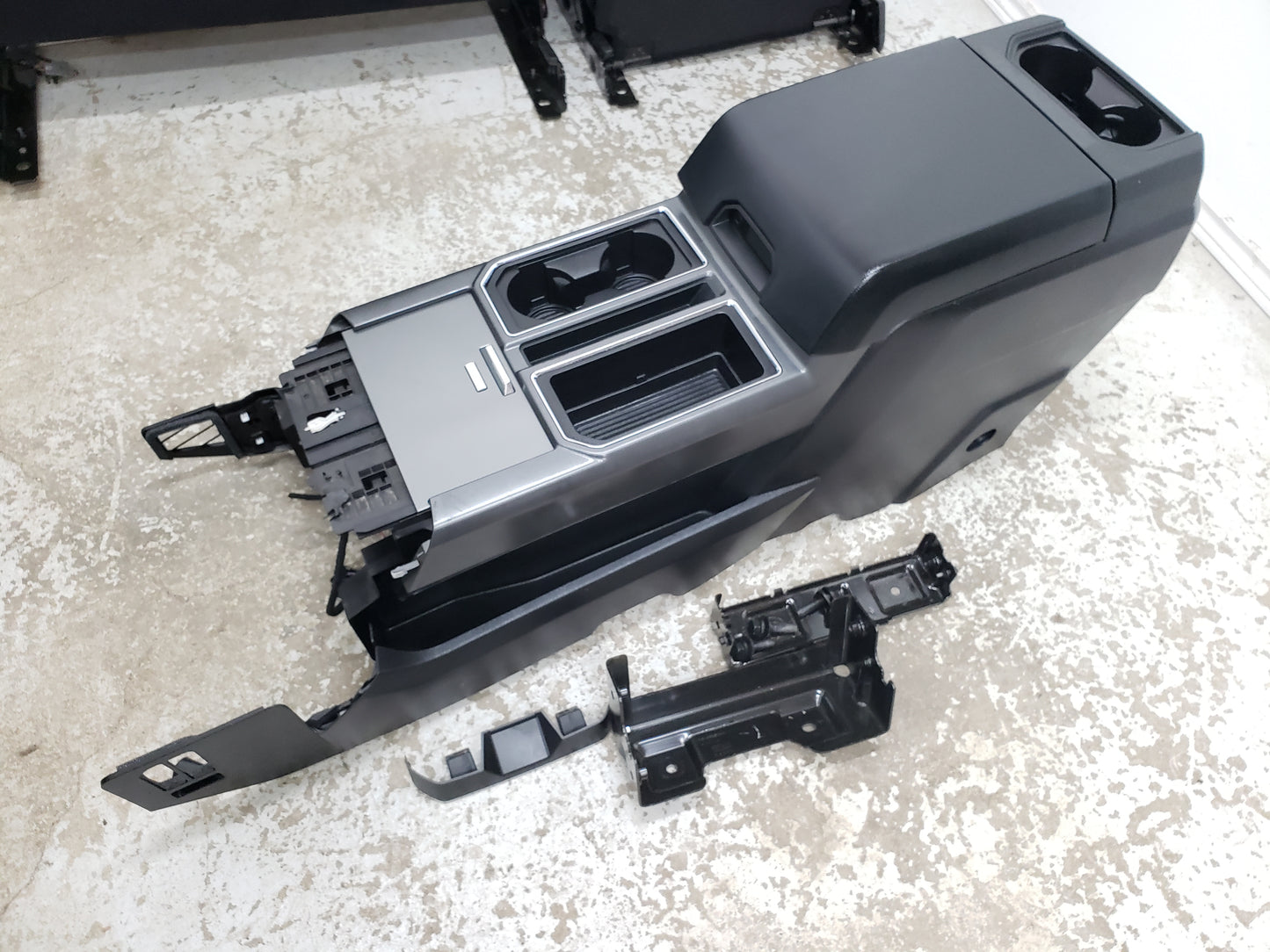 Hard plastic storage type center console from a 2017 Ford F150 Truck.  Fits F250 F350 F450 superduty 2015 2016 2017 2018