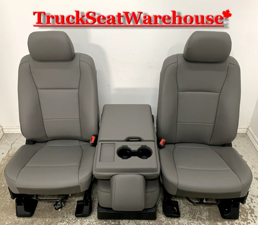 Grey vinyl manual front seats and center fold down seat console . New take outs from a 2022 Ford F250 Super Duty Regular Cab F350 F450 F550
