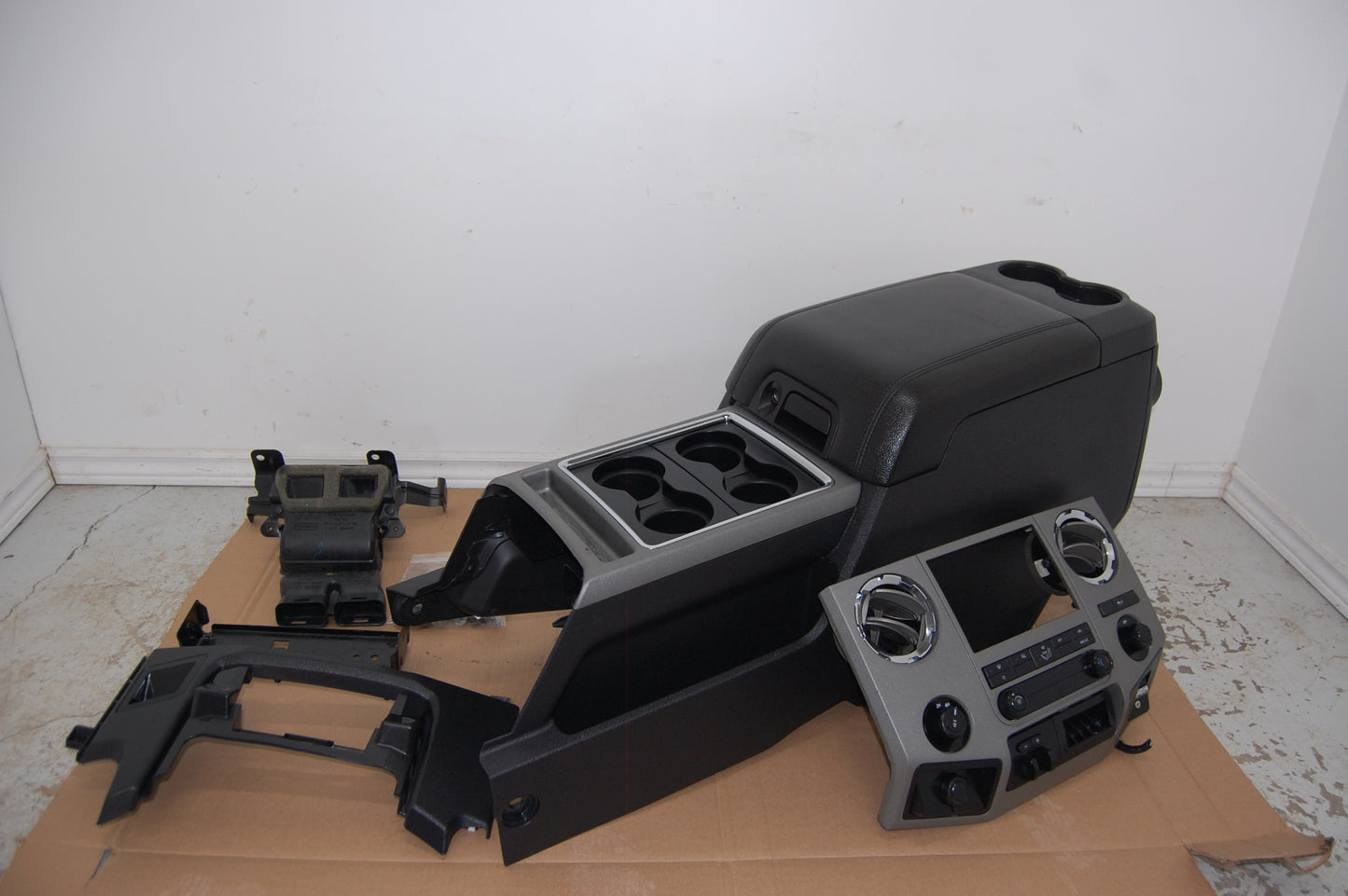 Hard black plastic storage console from a 2013 Ford F250 Superduty truck. F350 F450 F550 