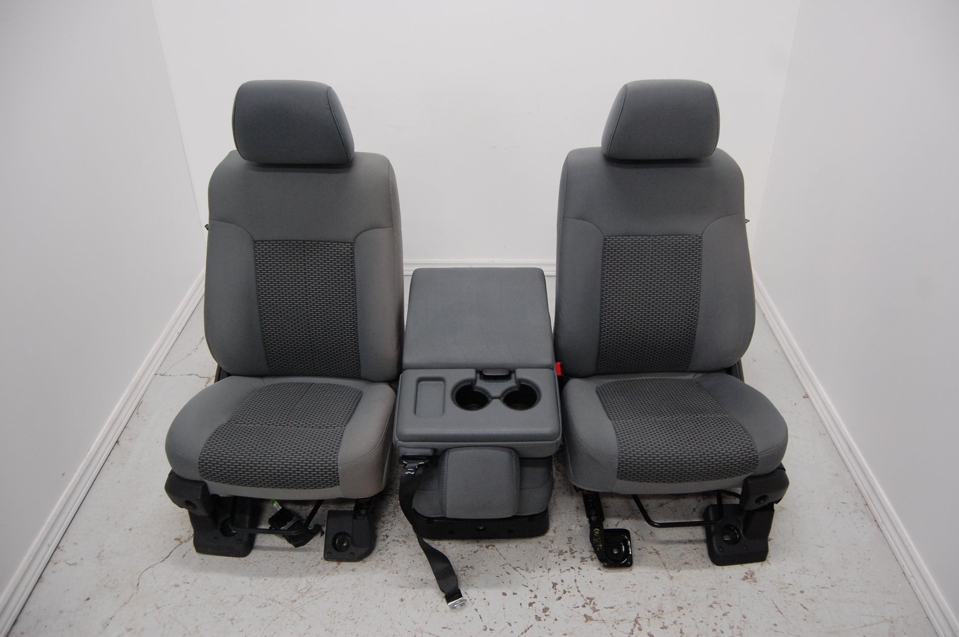 Grey cloth manual front seats and fold down seat console from a 2012 Ford F250 Superduty Truck F350 F450 F550 2009 2010 2011 2012 2013 2014